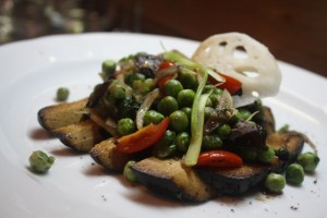Black tofu, sauteed peas with tamarind syrup from Birds in a Row