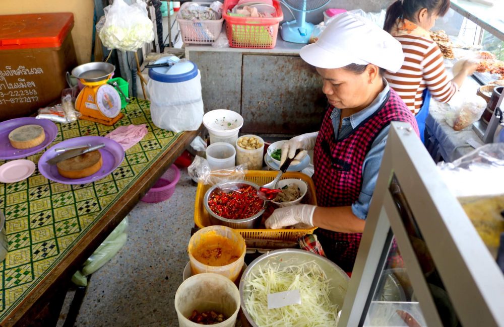 The chef at a local restaurant uses chicken feet in her recipe for papaya salad