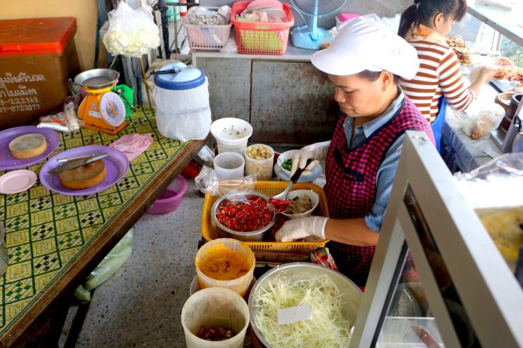 The chef at a local restaurant uses chicken feet in her recipe for papaya salad