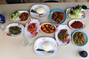 Full Table of Thai-Burmese salads curries, and rice, at at Nong Bee Burmese Library